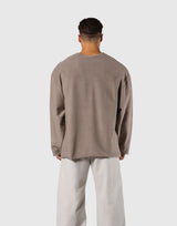 Pile Wappen Knit Like Loose Sweat Shirt - Beige