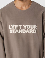 Pile Wappen Knit Like Loose Sweat Shirt - Beige