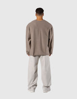 Pile Wappen Knit Like Loose Sweat Shirt - Beige